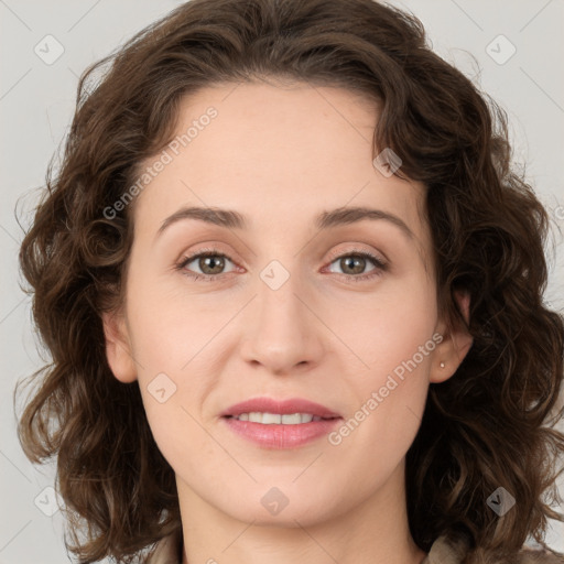 Joyful white young-adult female with medium  brown hair and green eyes