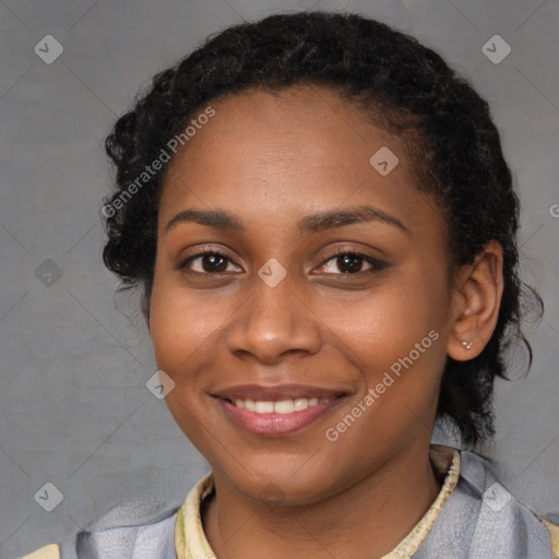 Joyful black young-adult female with long  brown hair and brown eyes