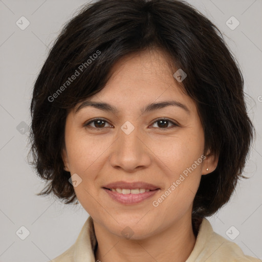 Joyful asian adult female with medium  brown hair and brown eyes