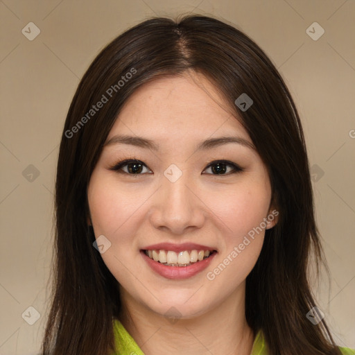 Joyful asian young-adult female with long  brown hair and brown eyes