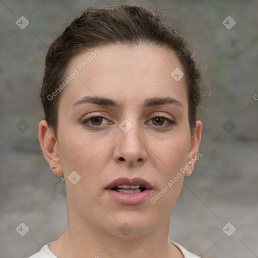 Joyful white young-adult female with short  brown hair and grey eyes