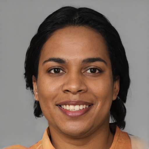Joyful black young-adult female with medium  black hair and brown eyes