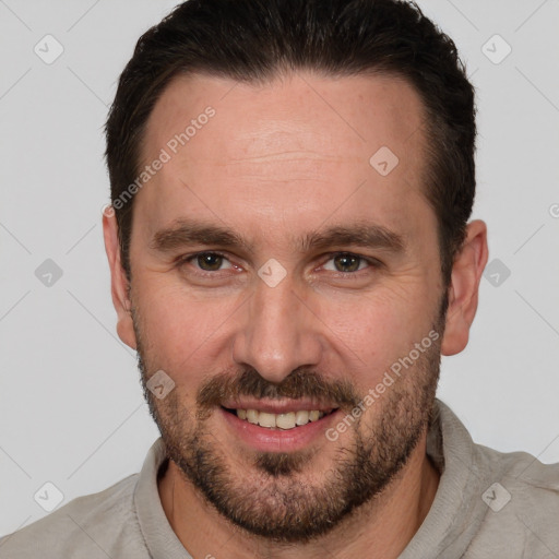 Joyful white adult male with short  brown hair and brown eyes