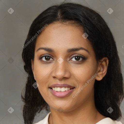 Joyful black young-adult female with medium  brown hair and brown eyes