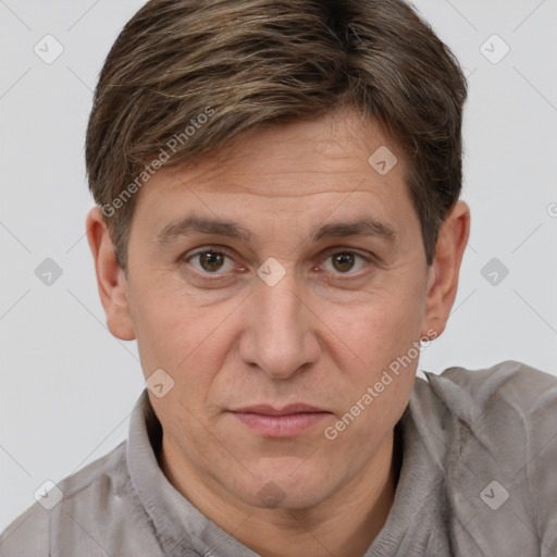 Joyful white adult male with short  brown hair and brown eyes