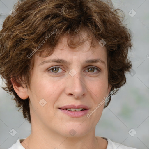 Joyful white adult female with medium  brown hair and green eyes