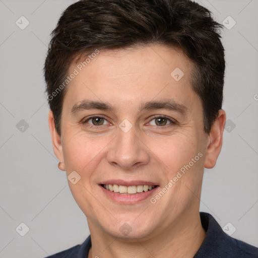 Joyful white adult male with short  brown hair and brown eyes