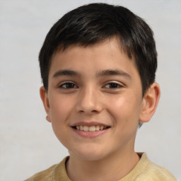 Joyful white child male with short  brown hair and brown eyes