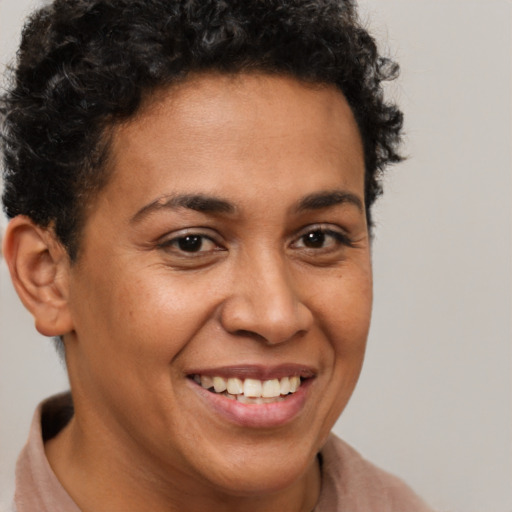 Joyful latino young-adult female with short  brown hair and brown eyes