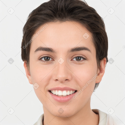 Joyful white young-adult female with short  brown hair and brown eyes