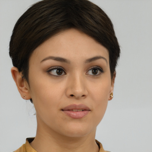 Joyful asian young-adult female with short  brown hair and brown eyes