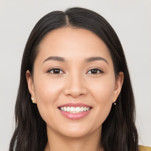 Joyful white young-adult female with long  black hair and brown eyes