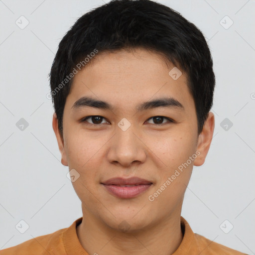 Joyful asian young-adult male with short  brown hair and brown eyes