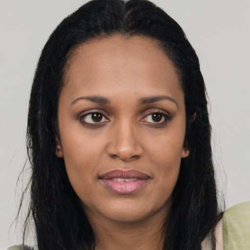 Joyful asian young-adult female with long  brown hair and brown eyes