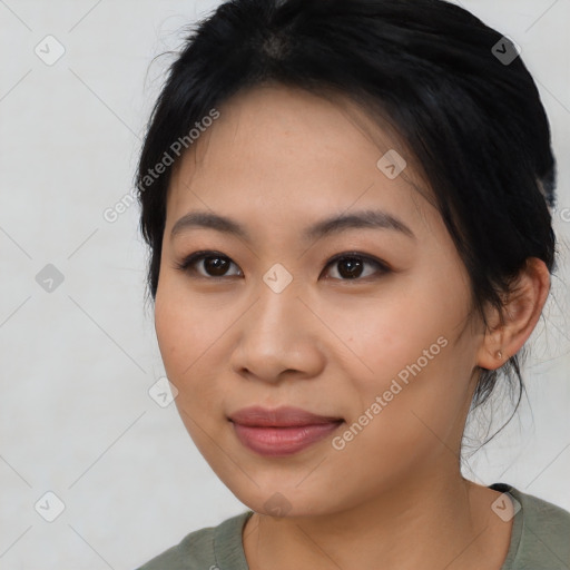 Joyful asian young-adult female with medium  black hair and brown eyes