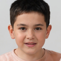 Joyful white child male with short  brown hair and brown eyes