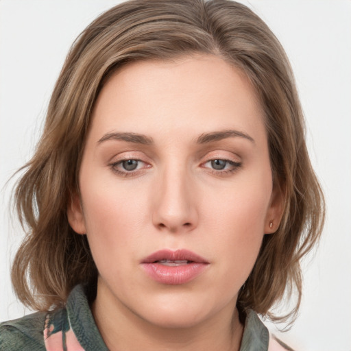 Neutral white young-adult female with medium  brown hair and grey eyes