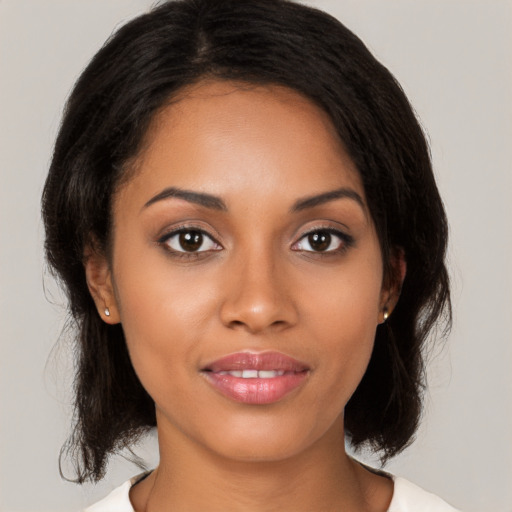 Joyful latino young-adult female with medium  black hair and brown eyes