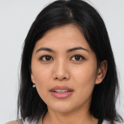 Joyful asian young-adult female with medium  brown hair and brown eyes