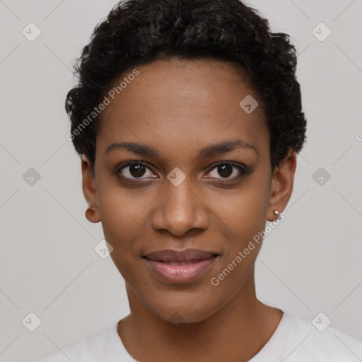 Joyful black young-adult female with short  black hair and brown eyes