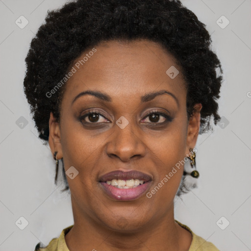 Joyful black adult female with short  brown hair and brown eyes