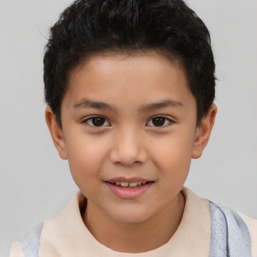 Joyful asian child male with short  brown hair and brown eyes