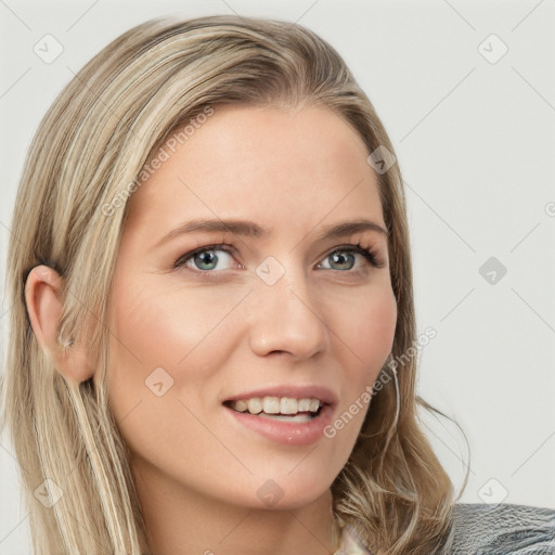 Joyful white young-adult female with long  brown hair and blue eyes