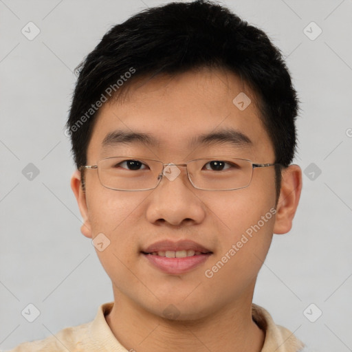 Joyful asian young-adult male with short  brown hair and brown eyes