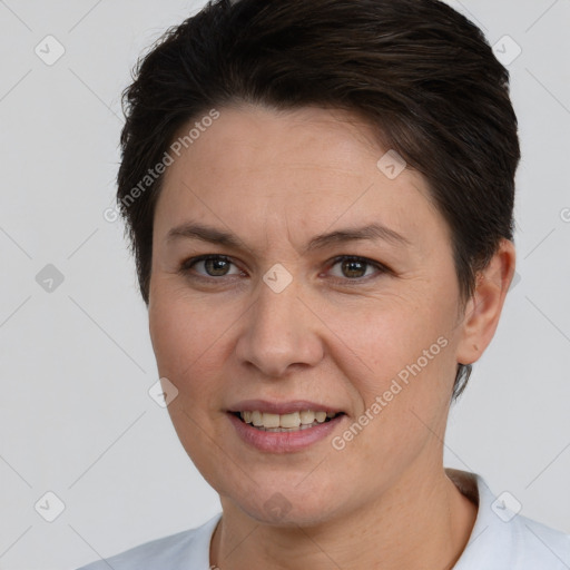 Joyful white adult female with short  brown hair and brown eyes