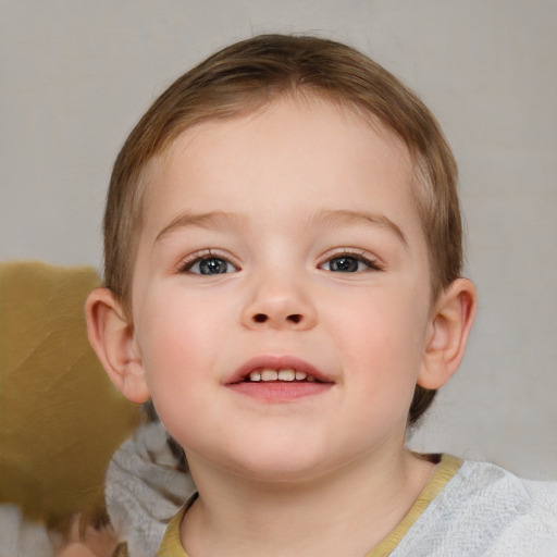 Joyful white child female with short  brown hair and blue eyes