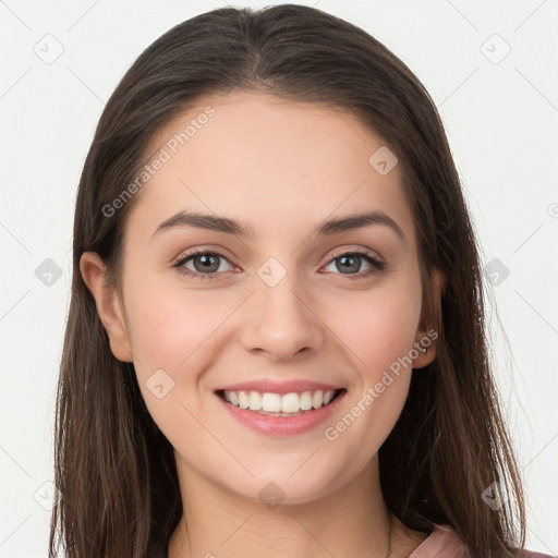 Joyful white young-adult female with long  brown hair and grey eyes