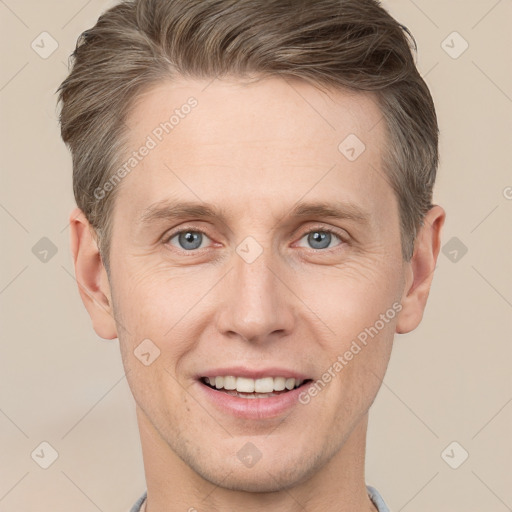 Joyful white adult male with short  brown hair and grey eyes