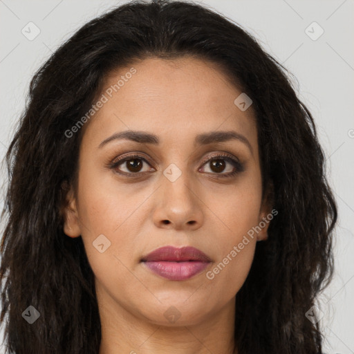 Joyful latino young-adult female with long  brown hair and brown eyes