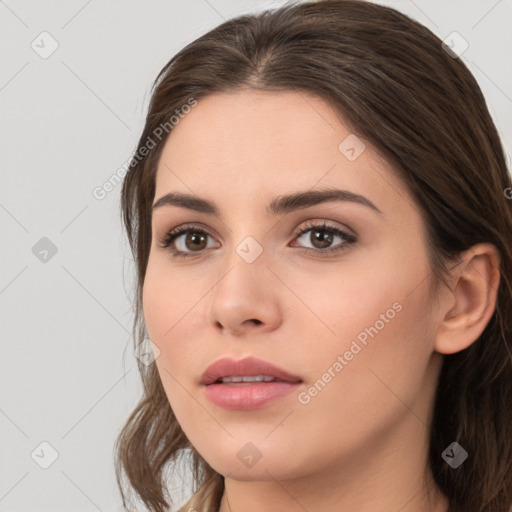 Neutral white young-adult female with long  brown hair and brown eyes