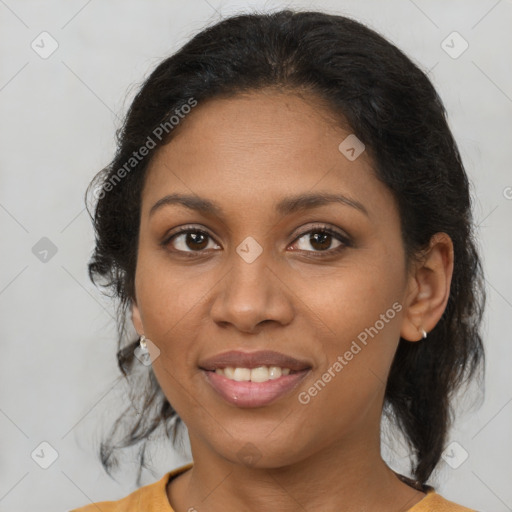 Joyful black young-adult female with medium  brown hair and brown eyes