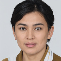 Joyful asian young-adult female with medium  black hair and brown eyes