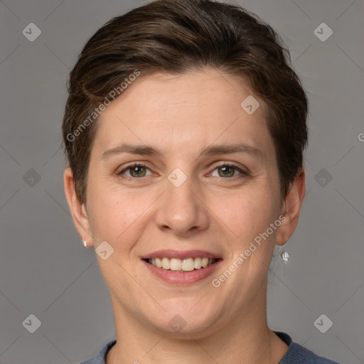 Joyful white young-adult female with short  brown hair and grey eyes