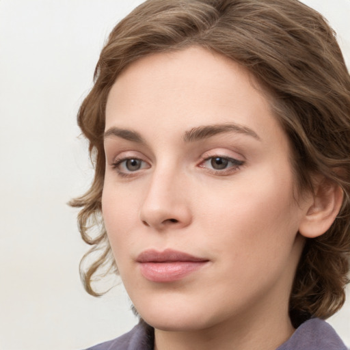 Neutral white young-adult female with medium  brown hair and grey eyes