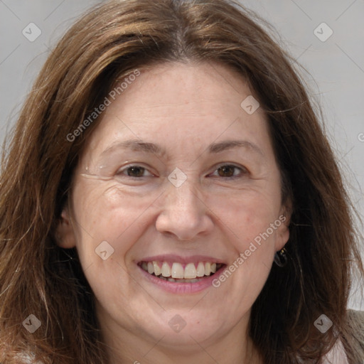 Joyful white adult female with long  brown hair and brown eyes