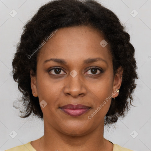 Joyful latino adult female with short  brown hair and brown eyes