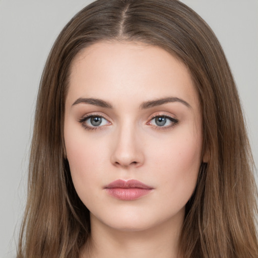 Neutral white young-adult female with long  brown hair and brown eyes