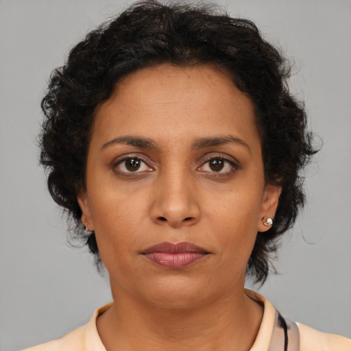 Neutral latino young-adult female with short  brown hair and brown eyes
