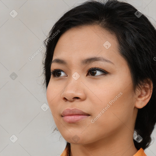 Neutral asian young-adult female with medium  brown hair and brown eyes