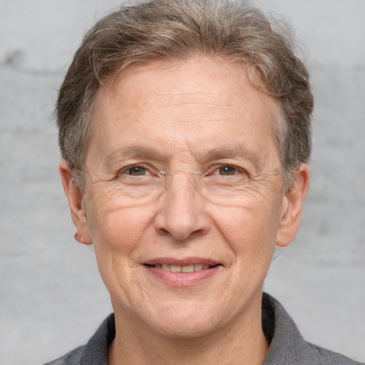 Joyful white middle-aged male with short  brown hair and grey eyes