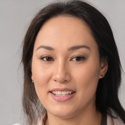 Joyful asian young-adult female with medium  brown hair and brown eyes