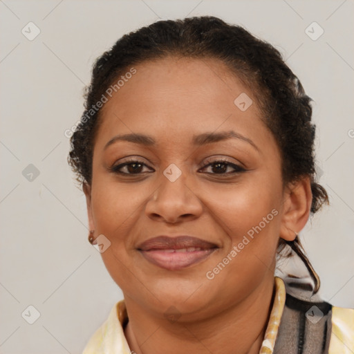 Joyful black adult female with short  brown hair and brown eyes