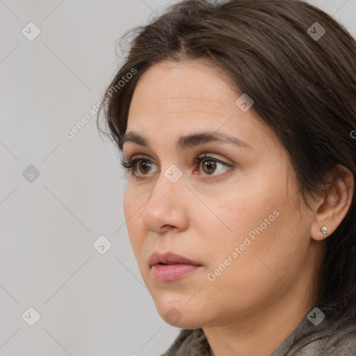 Neutral white young-adult female with medium  brown hair and brown eyes