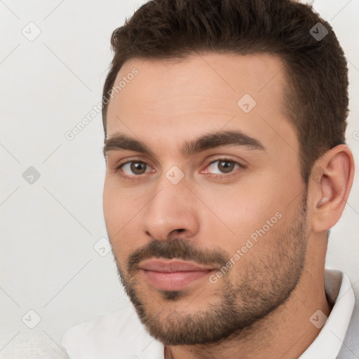 Neutral white young-adult male with short  brown hair and brown eyes