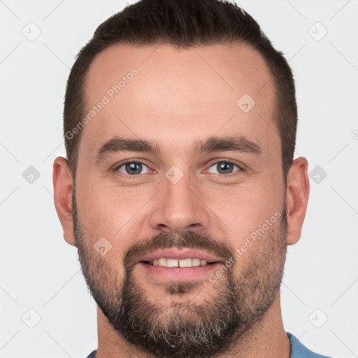 Joyful white young-adult male with short  brown hair and grey eyes