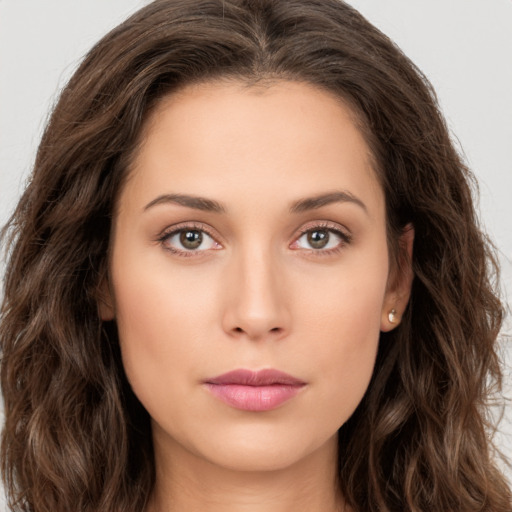 Neutral white young-adult female with long  brown hair and brown eyes